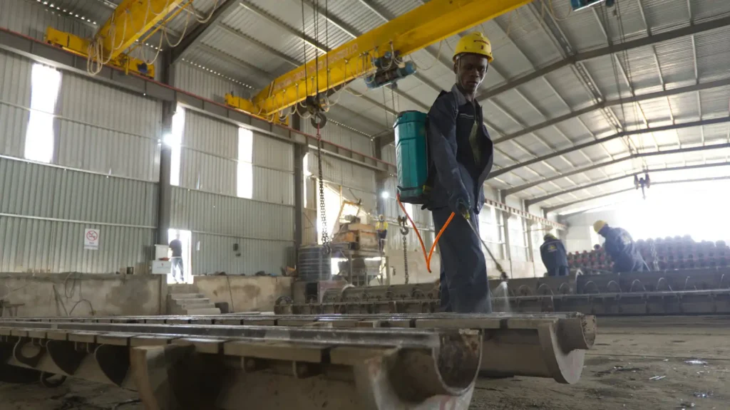 Heavy-duty steel molds preparation line for concrete electrical poles manufacturing.