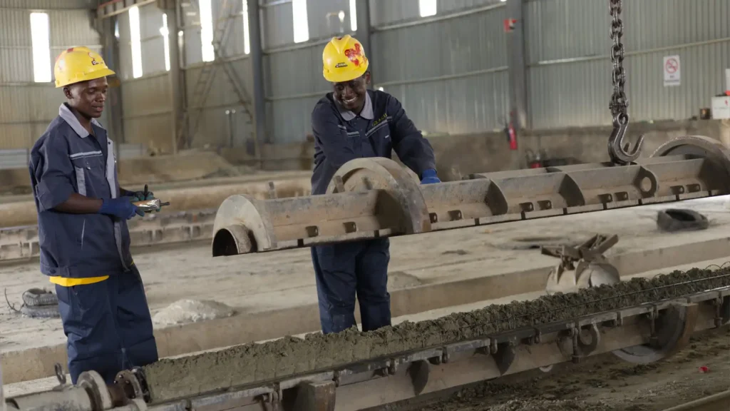 Heavy-duty steel molds preparation line for concrete electrical poles manufacturing.