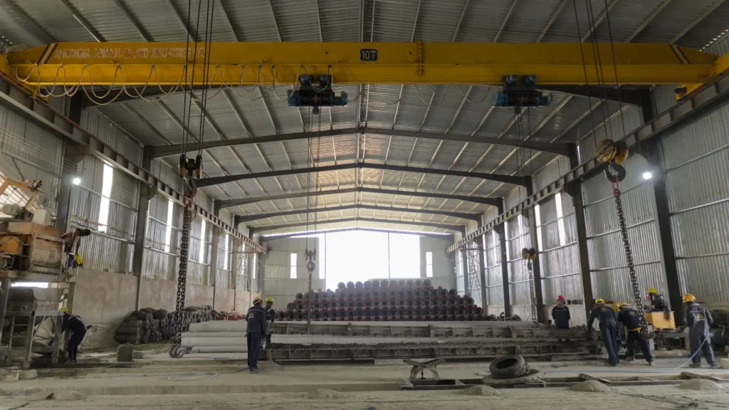 Heavy-duty steel molds preparation line for concrete electrical poles manufacturing.
